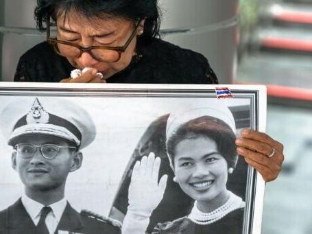 Black-clad Thai mourners weep for former Queen Sirikit